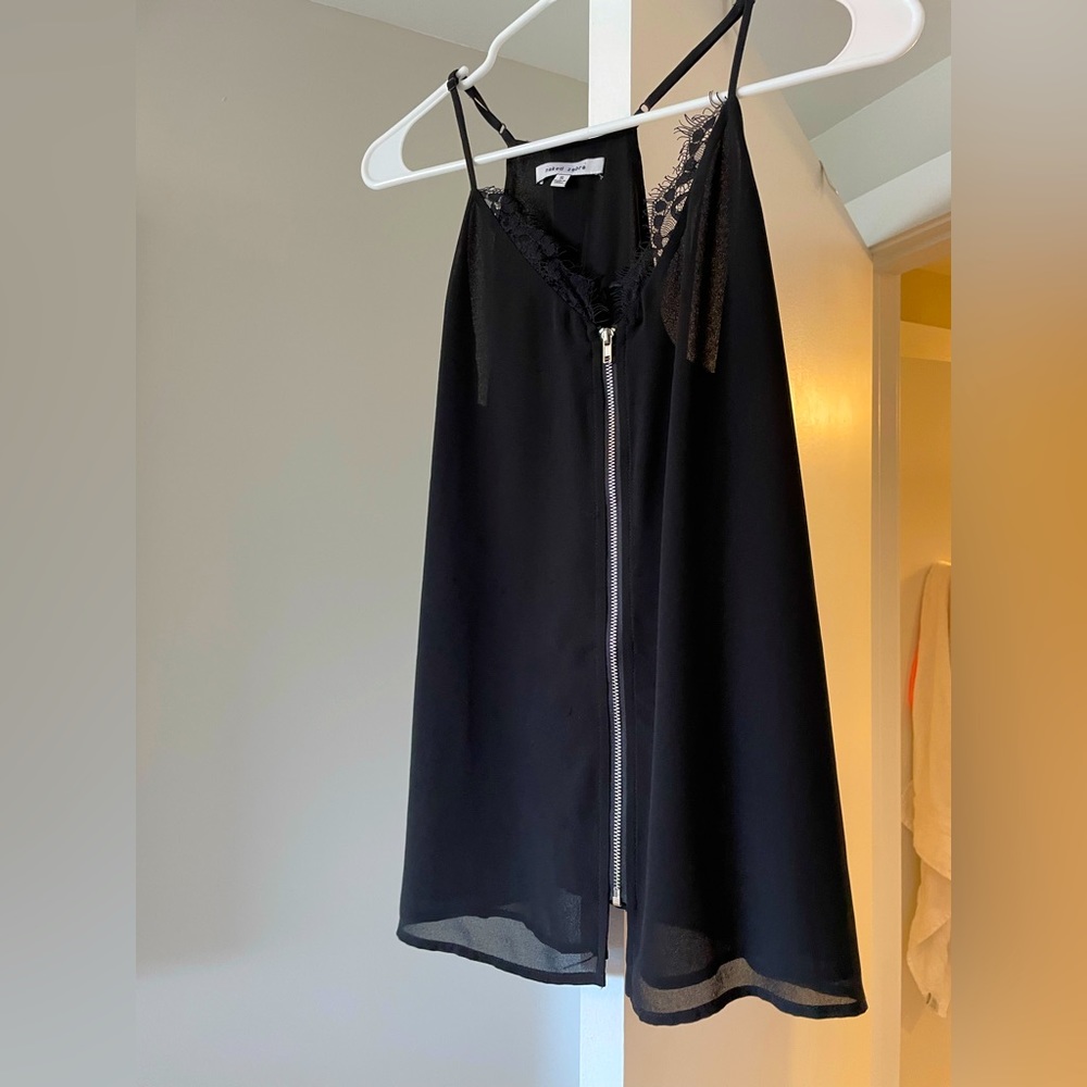 Selling this super cute black top. Barely worn. Looks like new.